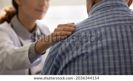 Female GP doctor giving empathy, support to senior 80s sick man, touching shoulder. Elderly male patient getting bad news, geriatric disease, pessimistic diagnosis from therapist. Banner Royalty-Free Stock Photo #2036344154