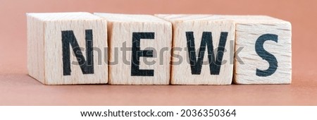 News text arranged from wooden blocks