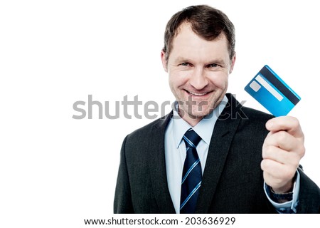 Handsome corporate man showing his credit card