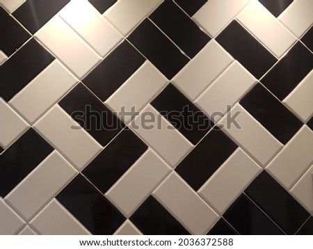Black and white ceramic in blocks, interior and exterior. geometric, rectangles, pattern, texture, abstract architecture background. Beautiful close up macro top view. Full screen.