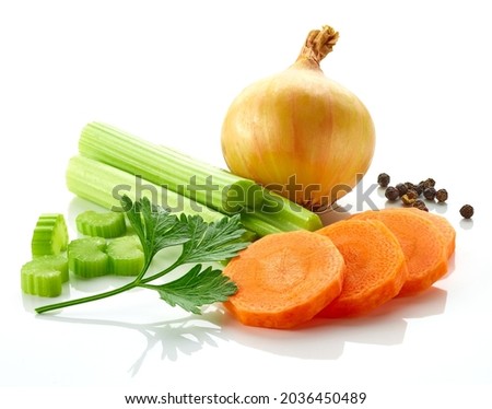 Set of spices for vegetable stock - celery sticks, carrot slices, parsley, onion and black pepper isolated on white background