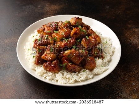 Chinese traditional cuisine sticky braised pork belly with rice on white plate Royalty-Free Stock Photo #2036518487