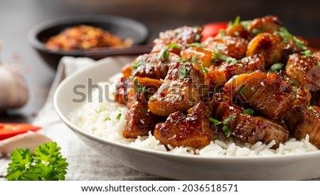 Chinese traditional cuisine sticky braised pork belly with rice on white plate Royalty-Free Stock Photo #2036518571