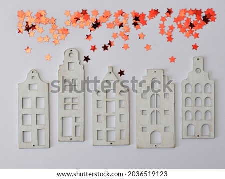 decoration with natural material. background. children's figurines made of wood flatlay house new year
