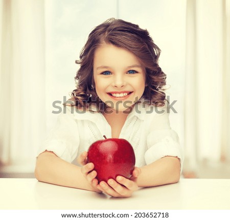 picture of beautiful girl with red apple