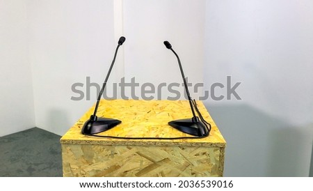 Online presentation. Microphones. Lighting devices ice. Stand for the presenter. Studio with white walls. Web tv