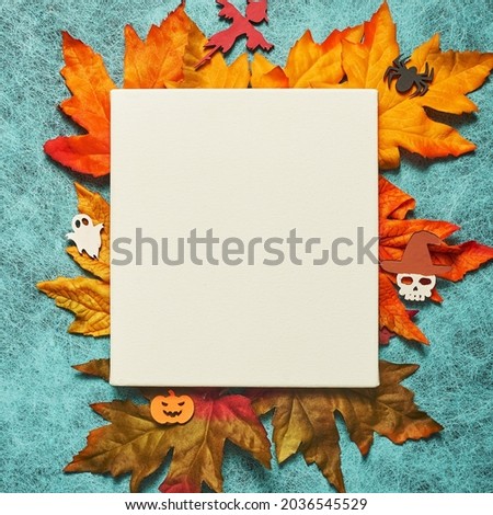 Halloween holiday on cobweb background with white leaf and leaf, pumpkin, ghost, scarecrow, skull, witch