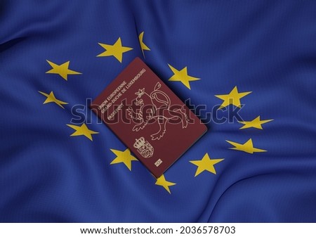 Luxembourg passport with European Union flag in background
