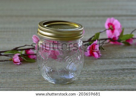 Empty glass jar for preservation on the table.