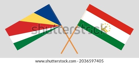 Crossed flags of Seychelles and Tajikistan. Official colors. Correct proportion