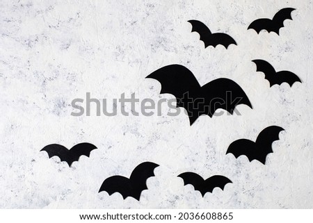 decoration paper bats on a white background. concept for halloween holiday background. Top view with copyspace