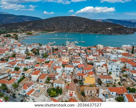 Aerial panoramic photo of picturesque seaside town of Ermioni built in peninsula with forest of Bistis at the end, Argolida, Peloponnese, Greece