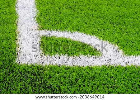 Closeup corner line on the artificial grass in a beautiful football field.