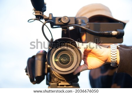 man filming with 4k camcorder