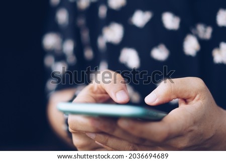 Woman hand using smartphone to do work business, social network, communication concept.