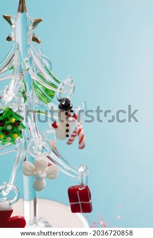 Glass Christmas tree with ornaments