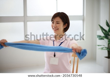 Image of a caregiver doing towel exercises 