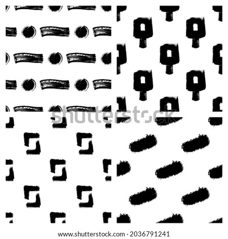Set of 4 black paint vector seamless patterns. Dry brush stroke textures. Abstract wallpapers, trendy textile prints. 