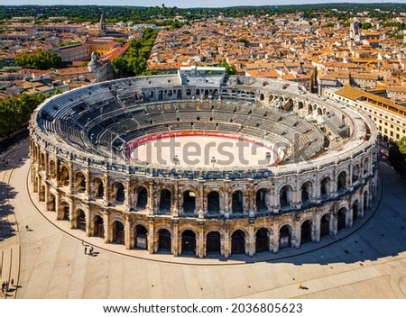 The aerial view of Arena of NÃrmes, an old Roman city in the Occitanie region of southern France Royalty-Free Stock Photo #2036805623