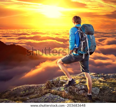 Backpacker on top of a mountaine