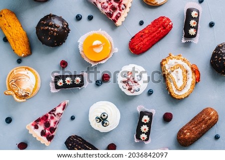Assortment of confectionery, different types of cakes and desserts on the table. Royalty-Free Stock Photo #2036842097