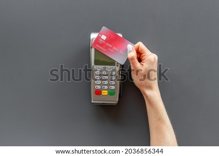 Hand paying by card with pos payment terminal. Payment transactions concept Royalty-Free Stock Photo #2036856344