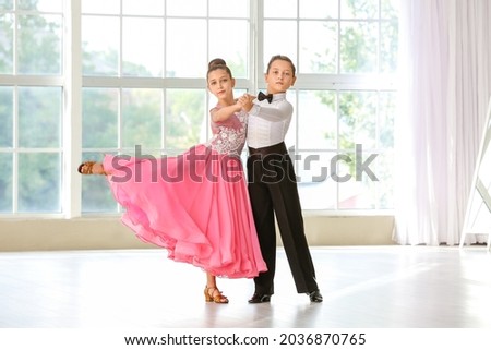 Cute little children dancing in studio Royalty-Free Stock Photo #2036870765