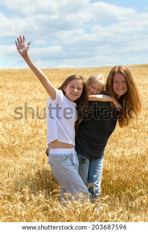 mother with daughters outdoors  