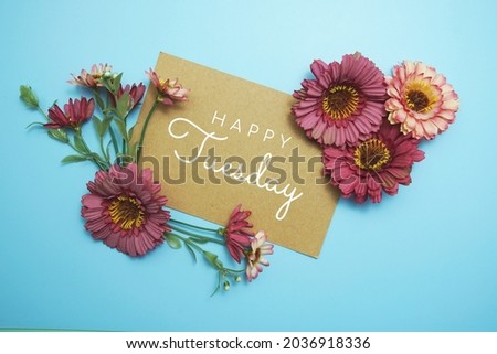 Happy Tuesday card typography text with flower bouquet on blue background