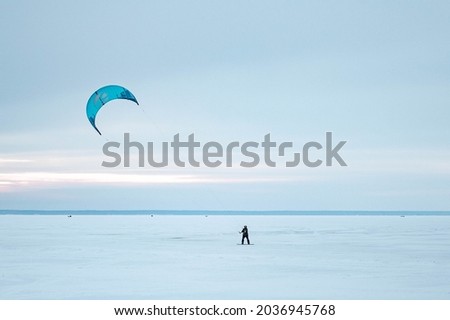 Snow surfing at Pärnu Beach 2 Royalty-Free Stock Photo #2036945768