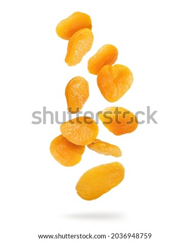 Delicious dried apricots in the air isolated on white background Royalty-Free Stock Photo #2036948759