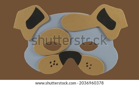 Dog mask on a brown background
