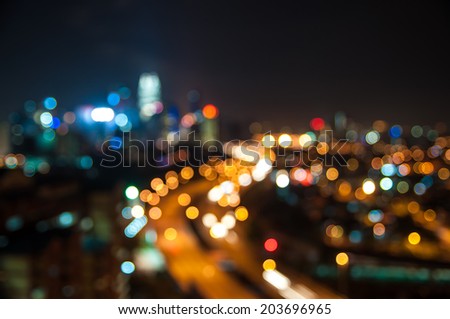 Blurred lights of Kuala Lumpur skyline, love shape bokeh