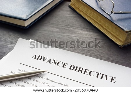 Medical Advance directive form and book with glasses. Royalty-Free Stock Photo #2036970440
