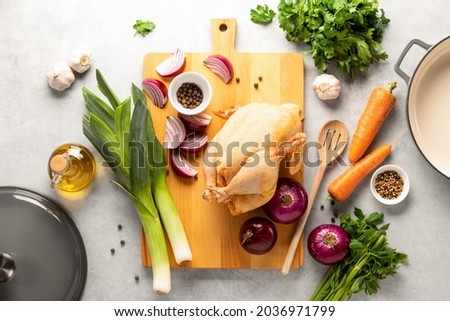 Chicken stock ingredients lying down on the kitchen table, traditional culinary recipe concept, overhead view