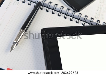 open notebook, mobile  phone and black  pen on white background