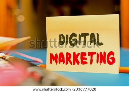 Text caption presenting Digital Marketing. Business concept marketing of products using digital technologies Multiple Assorted Collection Office Stationery Photo Placed Over Table