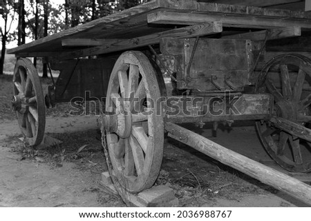 an ancient wooden horse-drawn cart