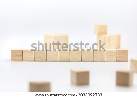 Ten blank wooden block cubes on a white background for your text. free space for business concept template and banner.
