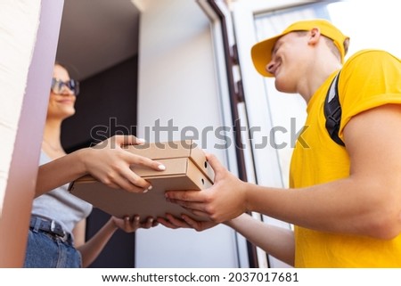 Close-up hands of deliveryman delivers order to clients, customers, buyers. Work, career, professions concept. Trends of modern lifestyle, demands of society. Idea of convenience, safety, service.