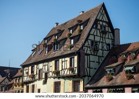 View of hotel sign on medieval building face in the street in Colmar - France 