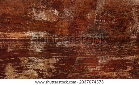 old scratched mahogany red wood plank textured background