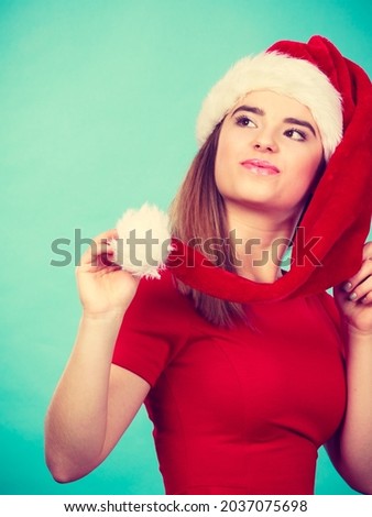 Xmas, seasonal clothing, winter christmas concept. Happy woman wearing Santa Claus helper costume