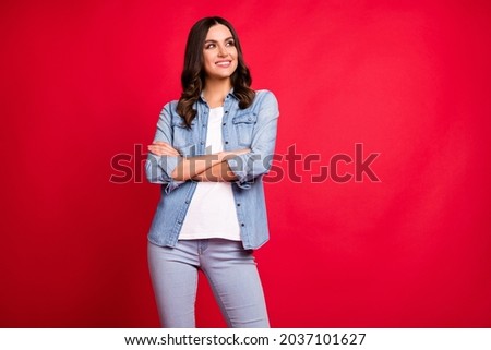 Photo of young attractive girl happy positive smile dream folded hands look empty space isolated over red color background