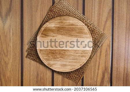Napkin and wooden board for pizza on the desk