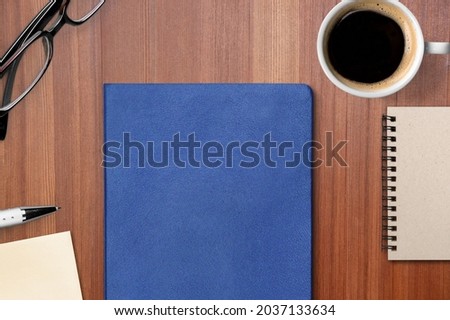 Concept of employee handbook over wooden office table. Royalty-Free Stock Photo #2037133634