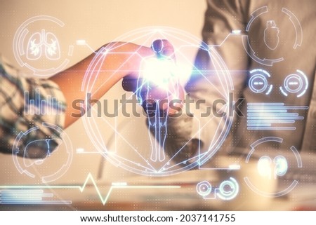 Double exposure of education theme hologram and handshake of two men.