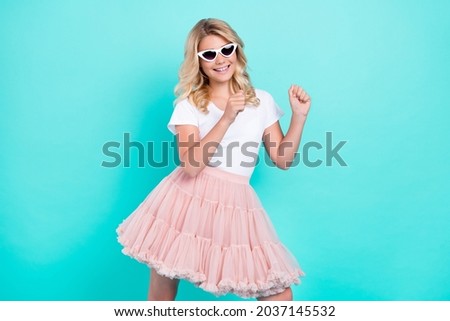 Photo of carefree dancer lady enjoy dance wear sunglass white t-shirt isolated aquamarine color background