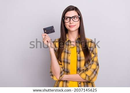 Photo of young attractive woman happy positive smile pay shop debit card isolated over grey color background