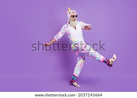 Full length body size view of nice funny cheerful man in pajama walking having fun isolated over violet purple color background Royalty-Free Stock Photo #2037145664